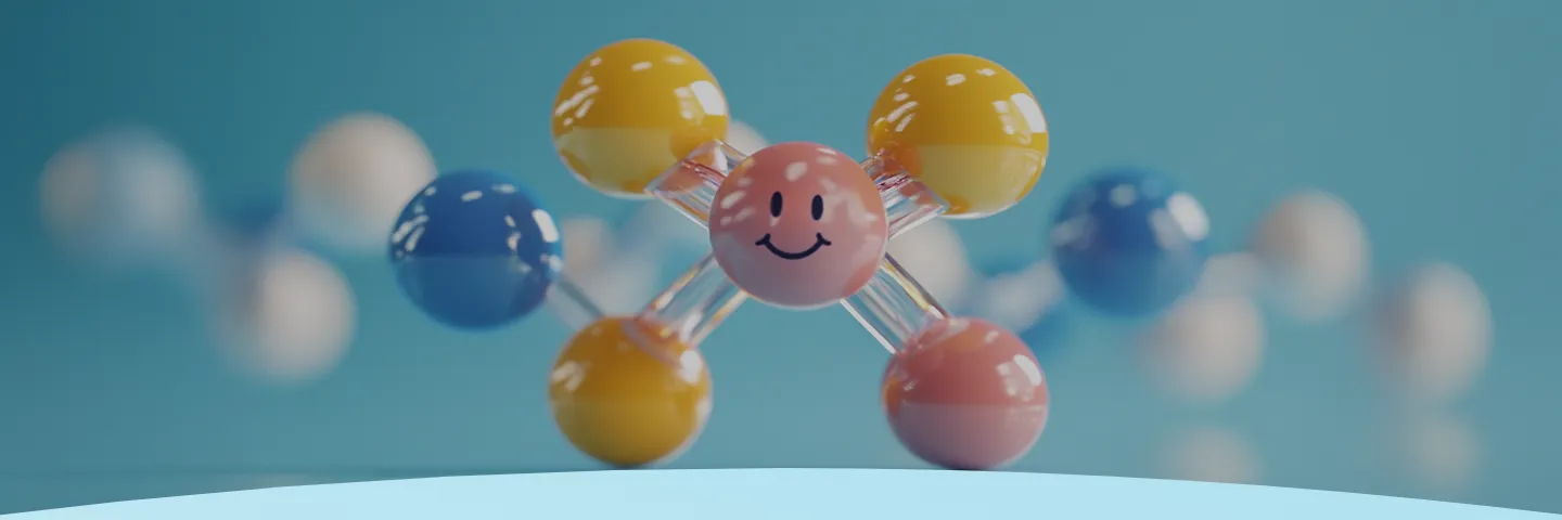 Modelo molecular colorido com um rosto sorridente no centro em um fundo azul.