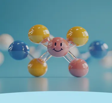 Modelo molecular colorido com um rosto sorridente no centro em um fundo azul.