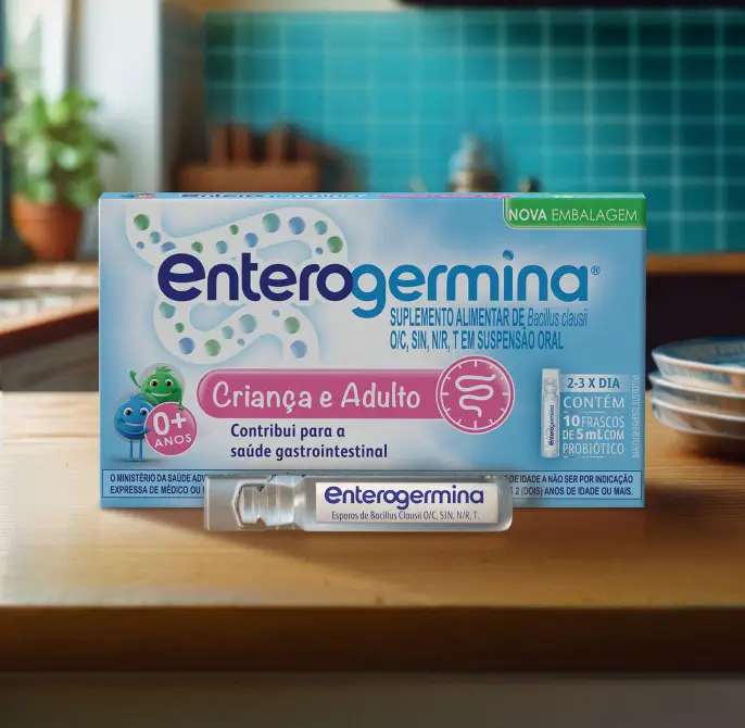 Enterogermina Criança e Adulto, 10 frascos de 5 ml, suspensão probiótica em uma superfície de madeira.